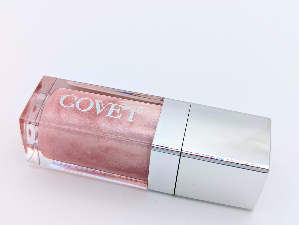 Lip gloss No. 7 Tease by 'COVET' on a light background