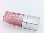 Lip gloss No. 7 Tease by 'COVET' on a light background