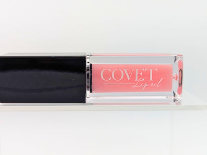 Covet Beauty’s Mercury lip gloss — a blush pink gloss in a clear rectangular tube with black cap. Transforms into a medium cool-toned pink based on skin pH and heat