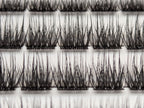 Covet Beauty Velvet cluster lashes shown close-up with a dense, defined crisscross lash pattern in the tray.
