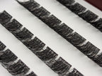 Covet Beauty Velvet cluster lashes shown close-up in diagonal rows with dense, curled fibers and a full lash pattern.