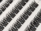 Close-up of Covet Beauty Obsession cluster lashes showing a wispy crisscross pattern in the tray.